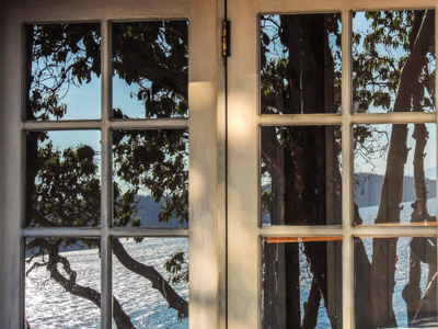 Photo Note Card: 
Reflection in a Window of an old Homestead Cabin, Frost Island, in the San Juan Islands, San Juan National Monument, Washington